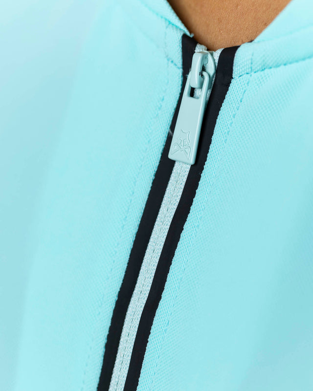 Polo de pádel turquesa WOW Zippy para mujer